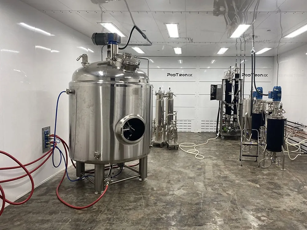 Closed-loop hydrocarbon extraction skid, jacketed reactor, and inline filtration housed inside a single-zone C1D1 enclosure.