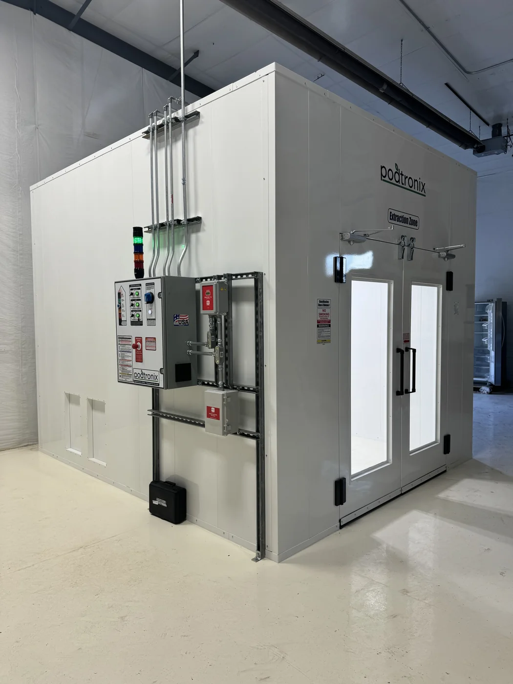 Podtronix extraction room entrance with exterior control panels