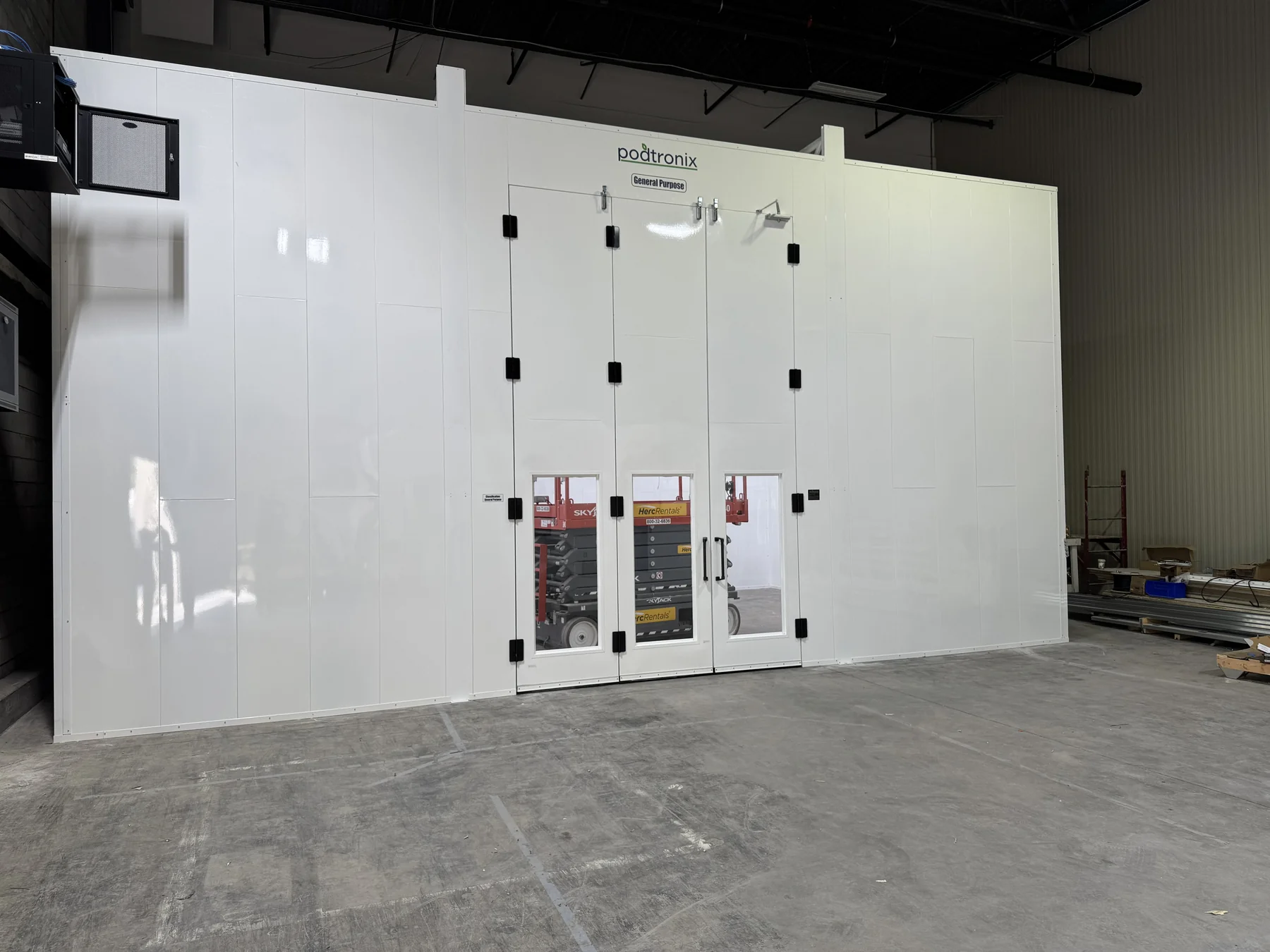 Extraction zone exterior with double doors and wall-mounted control panels