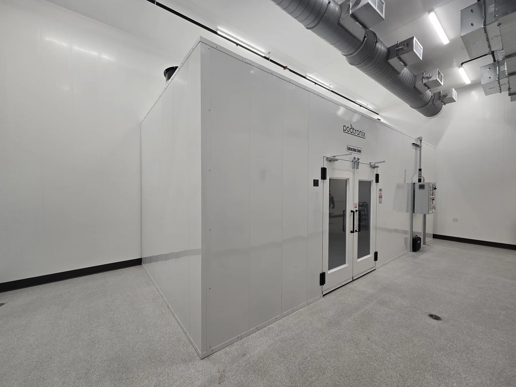 Completed modular room exterior with flush wall panels and double entry doors