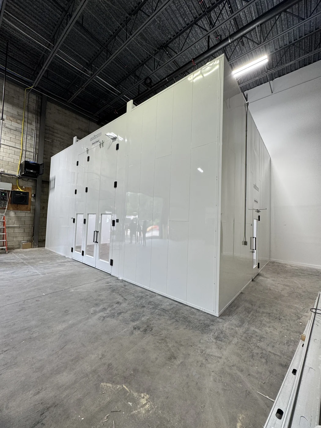 Large Podtronix enclosure within an industrial building
